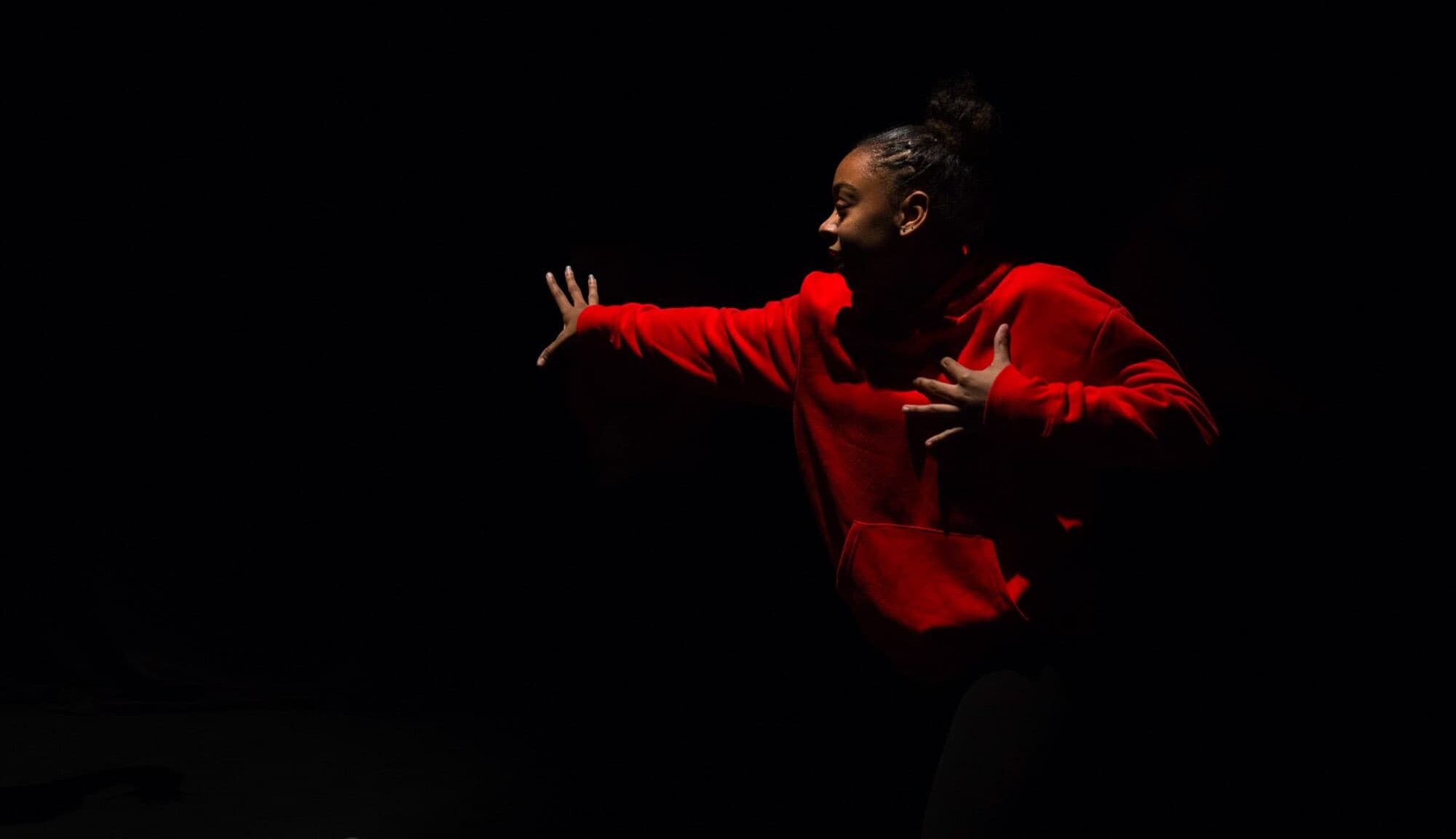 girl in red jumper performance